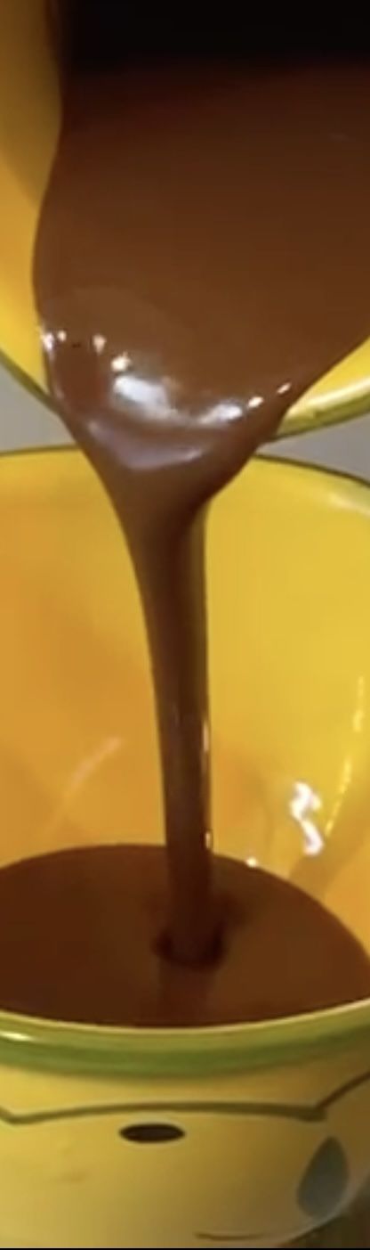 Smooth chocolate being poured, showing the rich texture of Delessa chocolate spreads